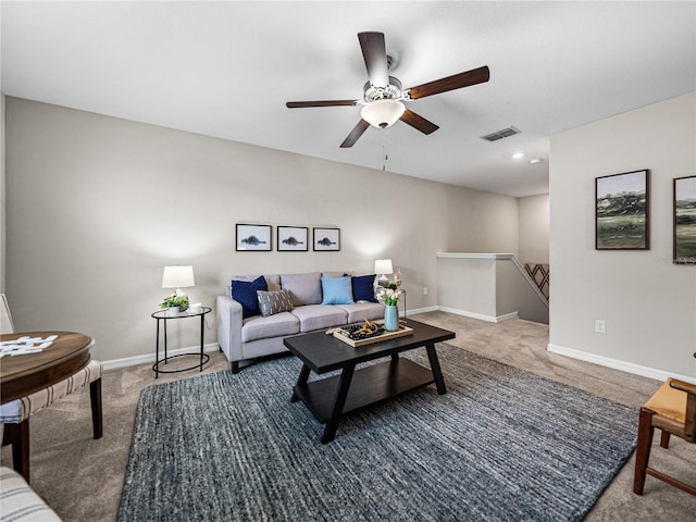 living room with ceiling fan and carpet flooring