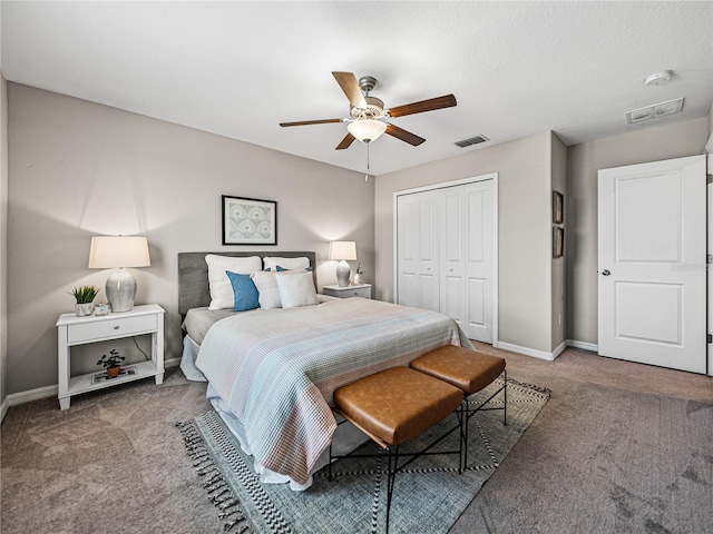 bedroom with carpet floors, ceiling fan, and a closet