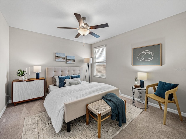 bedroom featuring ceiling fan and carpet