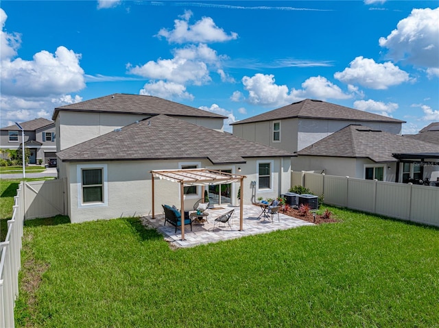 back of property with central AC unit, a pergola, a lawn, and a patio area