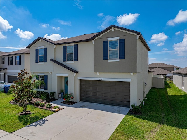 view of front of home featuring a front lawn and a garage