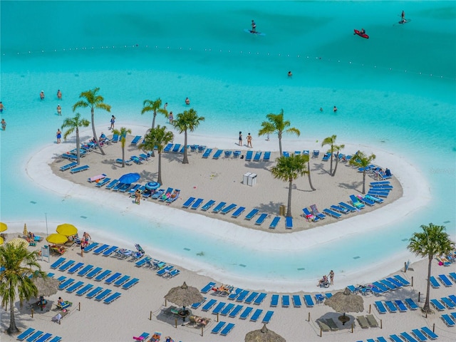 drone / aerial view with a beach view and a water view