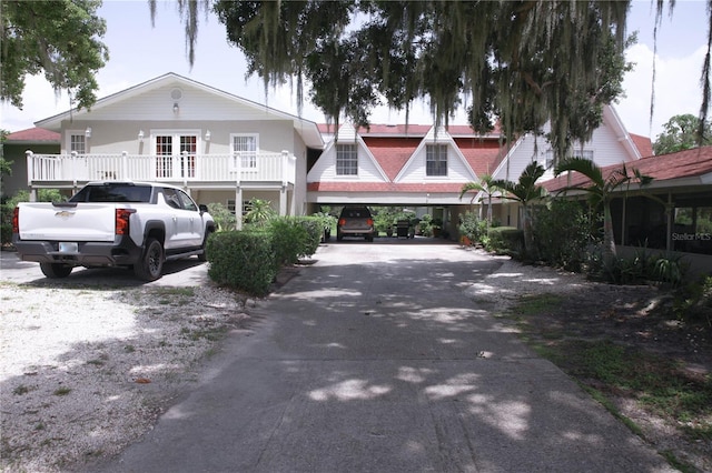 view of front of house featuring a balcony