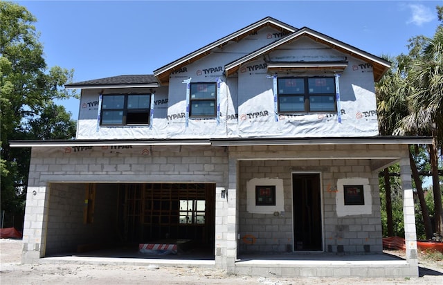 unfinished property with an attached garage