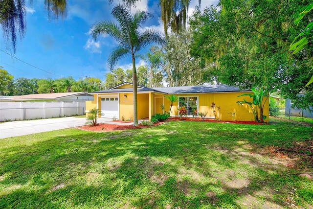 ranch-style house with a front lawn and a garage