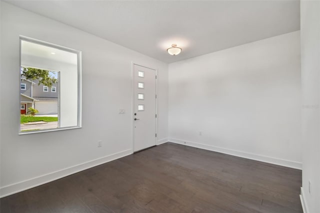 210 E Janette Ave, Tampa, FL 33603 - entrance foyer with dark wood finished floors and baseboards