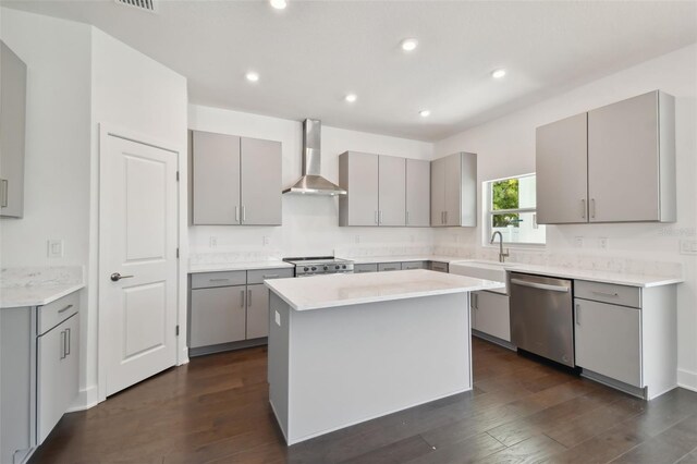 210 E Janette Ave, Tampa, FL 33603 - kitchen featuring a sink, wall chimney exhaust hood, dishwasher, and gray cabinetry