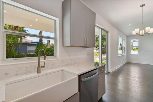 210 E Janette Ave, Tampa, FL 33603 - kitchen with gray cabinetry, a sink, hanging light fixtures, stainless steel dishwasher, and dark wood-style floors