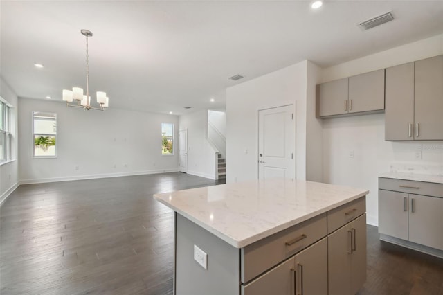 210 E Janette Ave, Tampa, FL 33603 - kitchen featuring a center island, dark wood finished floors, visible vents, and gray cabinetry