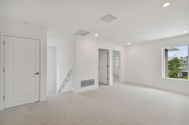 empty room with light colored carpet