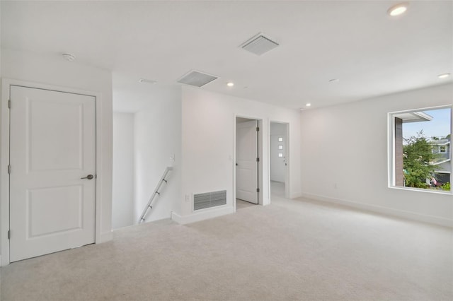 210 E Janette Ave, Tampa, FL 33603 - unfurnished room featuring light carpet, baseboards, visible vents, and recessed lighting