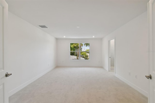 210 E Janette Ave, Tampa, FL 33603 - empty room with light carpet, baseboards, visible vents, and recessed lighting
