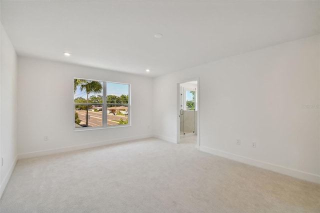 210 E Janette Ave, Tampa, FL 33603 - empty room featuring recessed lighting, baseboards, and light colored carpet