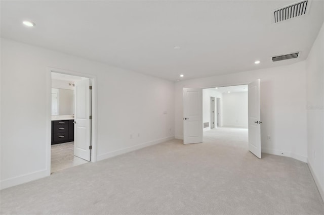 210 E Janette Ave, Tampa, FL 33603 - unfurnished room with light carpet, visible vents, and recessed lighting