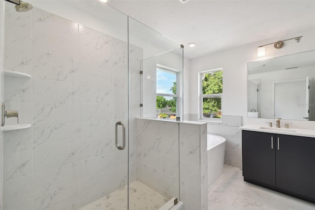 bathroom with tile patterned floors, independent shower and bath, vanity, and tile walls