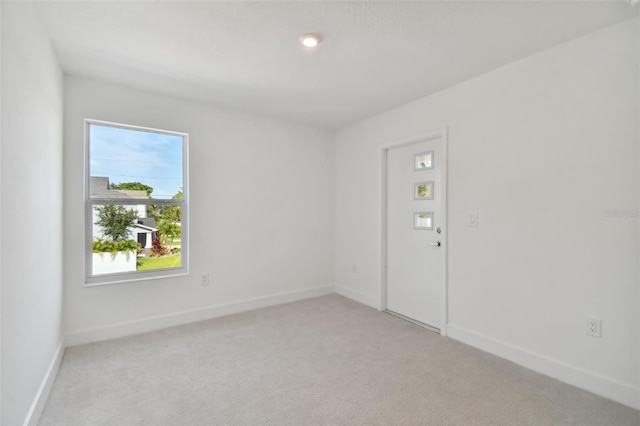 210 E Janette Ave, Tampa, FL 33603 - empty room with light colored carpet and baseboards