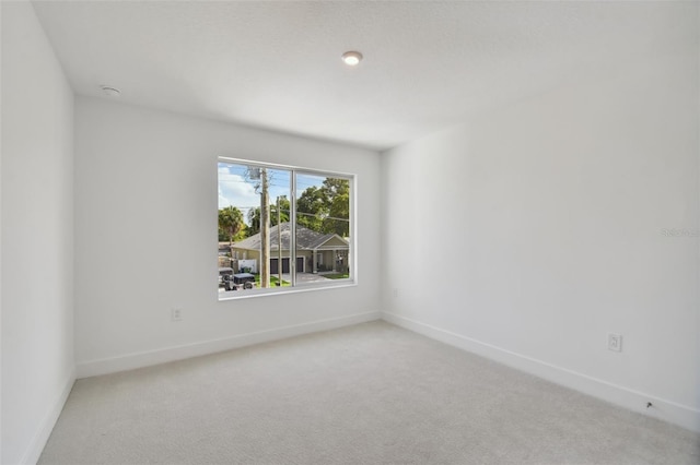 210 E Janette Ave, Tampa, FL 33603 - unfurnished room with light carpet and baseboards