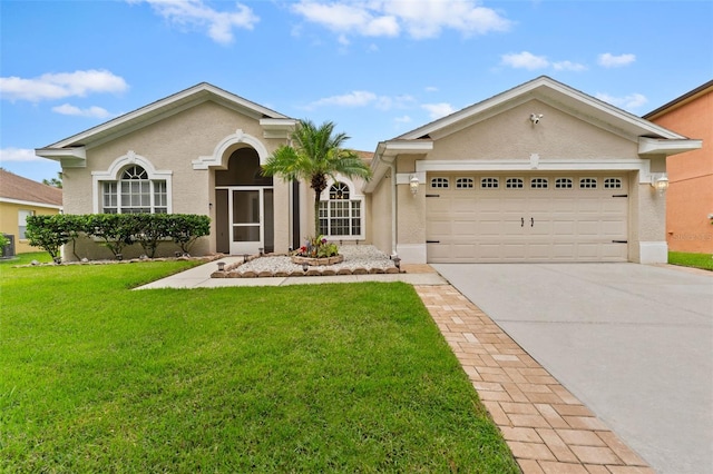 ranch-style house featuring a garage and a front yard