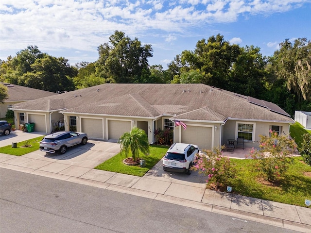 ranch-style house featuring a garage