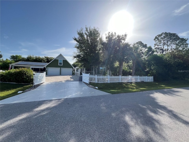 view of front facade featuring a garage and a front lawn