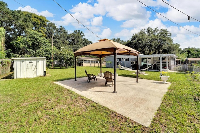 exterior space with a patio area, a gazebo, and a storage shed