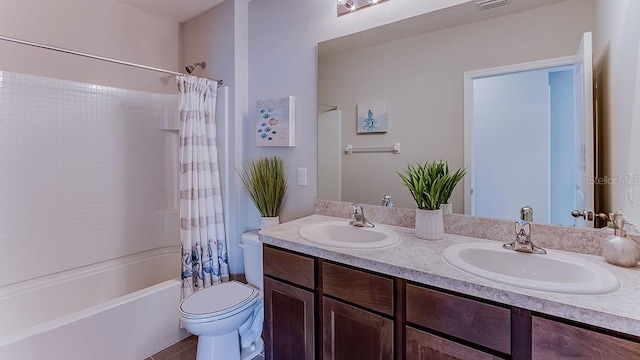 full bathroom featuring tile patterned floors, shower / bathtub combination with curtain, dual vanity, and toilet