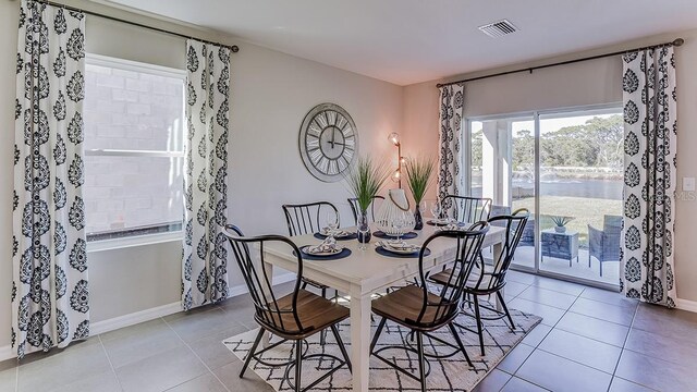 dining area with tile patterned flooring