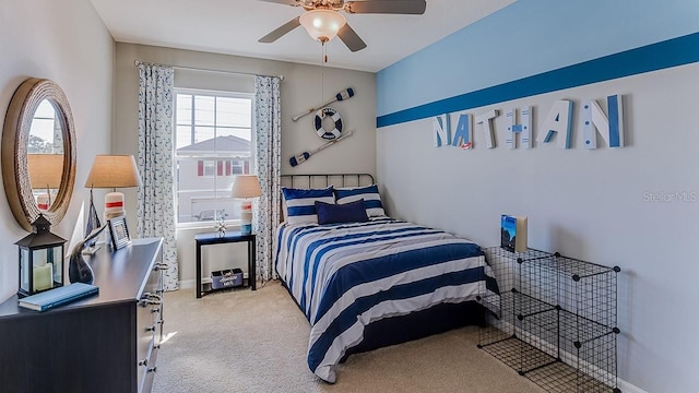 bedroom featuring ceiling fan and light carpet