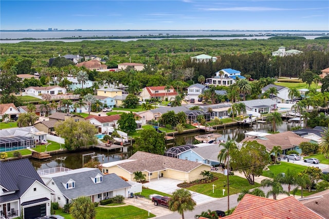 bird's eye view featuring a residential view and a water view