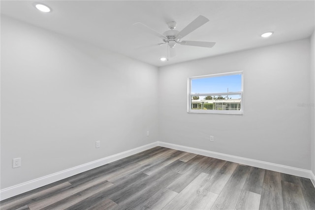 empty room with ceiling fan and wood-type flooring