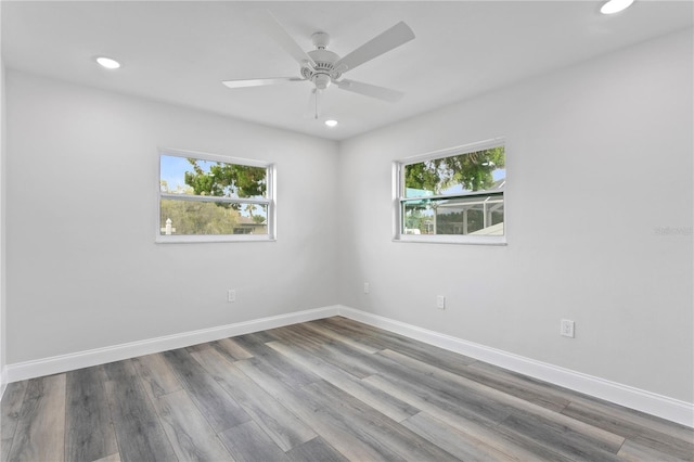 spare room with wood-type flooring and ceiling fan