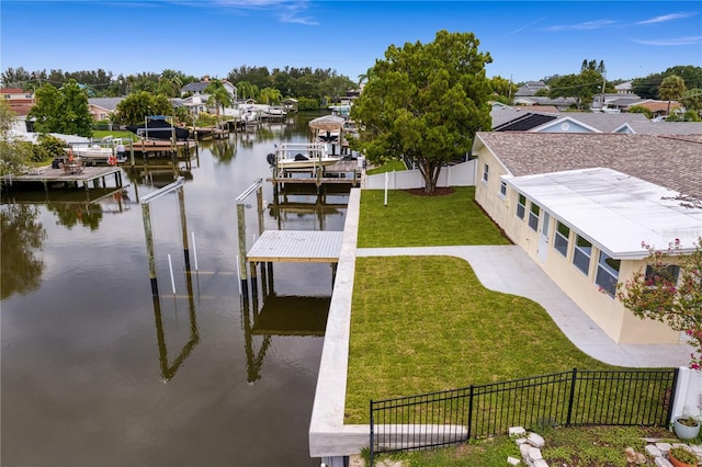 dock area with a water view and a lawn