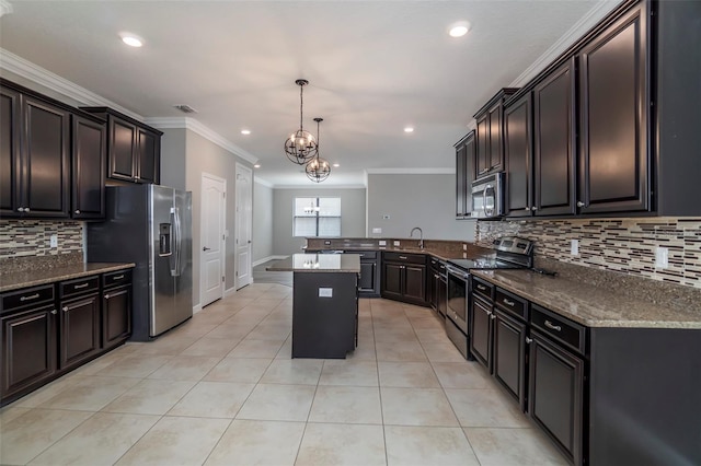 kitchen featuring light tile patterned floors, stainless steel appliances, a peninsula, a sink, and dark stone countertops