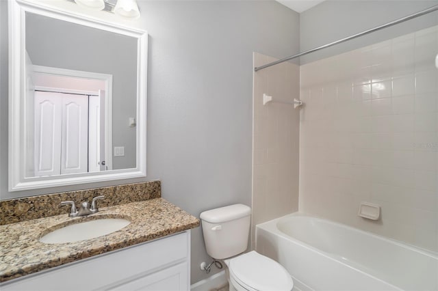 bathroom with  shower combination, vanity, and toilet