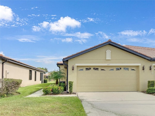 ranch-style house with a garage and a front yard