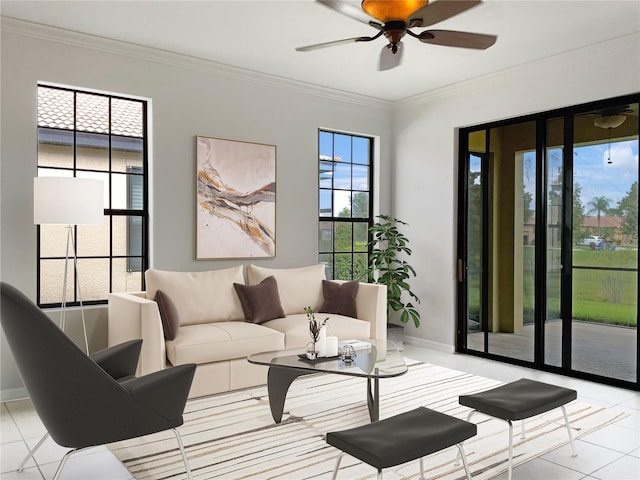 living area featuring a ceiling fan, light tile patterned floors, baseboards, and crown molding