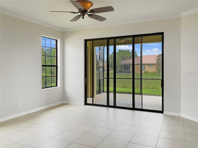 empty room featuring baseboards, ornamental molding, a ceiling fan, and light tile patterned flooring