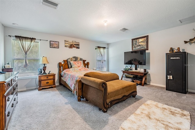 carpeted bedroom with a textured ceiling