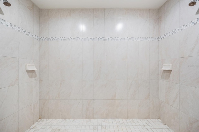 bathroom with tiled shower