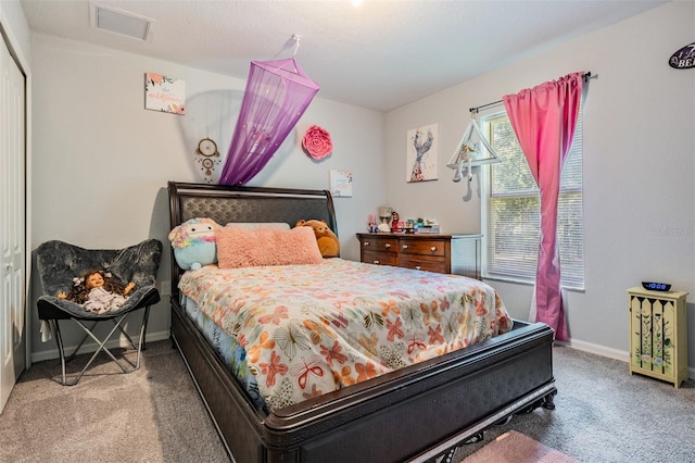 bedroom with carpet floors and a closet