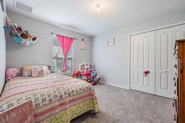 bedroom with carpet floors and a closet