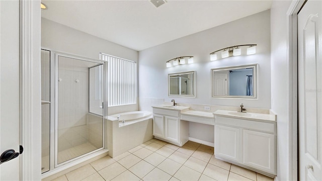 bathroom featuring separate shower and tub, tile patterned flooring, and vanity