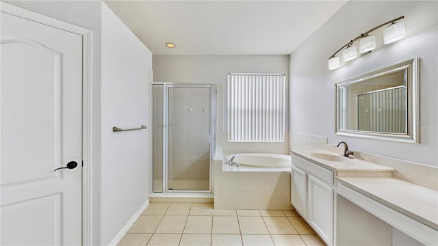 bathroom with tile patterned floors, vanity, and independent shower and bath