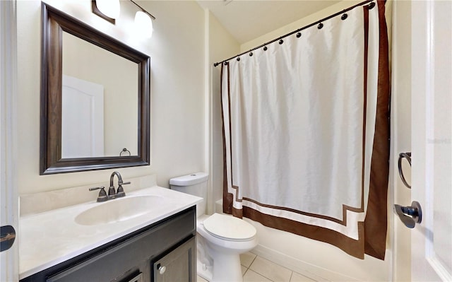 full bathroom featuring tile patterned floors, shower / tub combo with curtain, vanity, and toilet