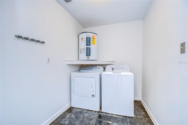 laundry area featuring washer and dryer, laundry area, visible vents, and baseboards