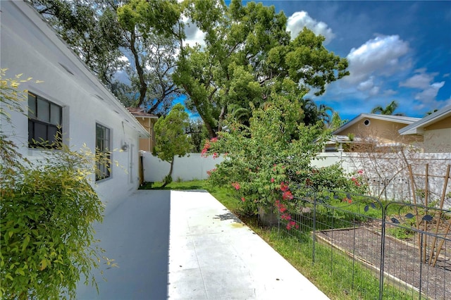 view of yard featuring a fenced backyard and a patio