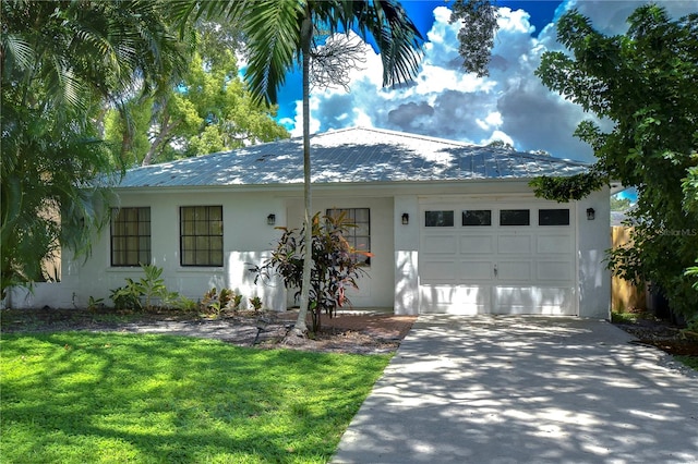 ranch-style home with a front yard and a garage