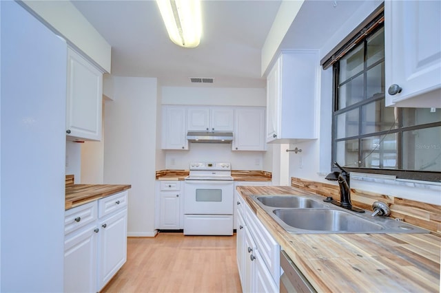 kitchen featuring white electric stove, butcher block counters, visible vents, a sink, and under cabinet range hood