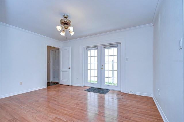 doorway to outside with ornamental molding, french doors, wood finished floors, and baseboards