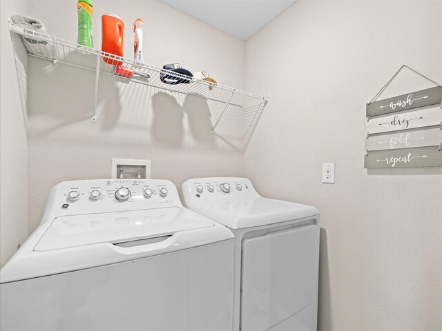 washroom featuring washer and dryer